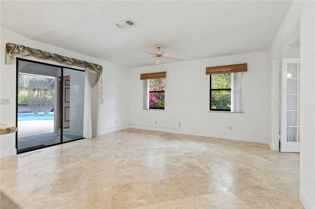 spare room with ceiling fan