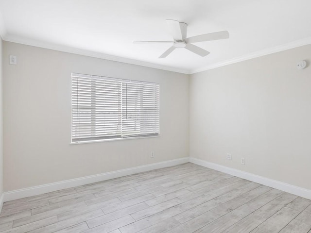 empty room featuring ceiling fan, light hardwood / wood-style flooring, and ornamental molding