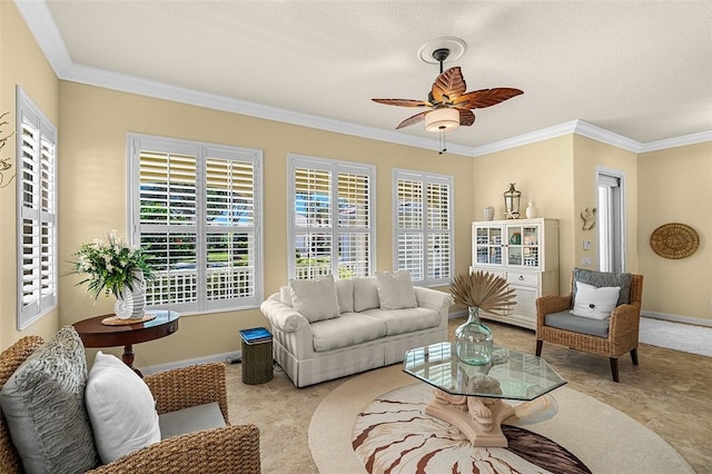 interior space featuring crown molding, baseboards, and ceiling fan