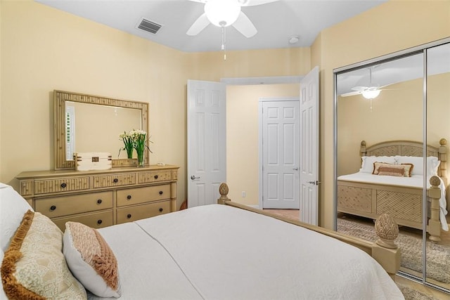 bedroom featuring a closet, visible vents, and ceiling fan