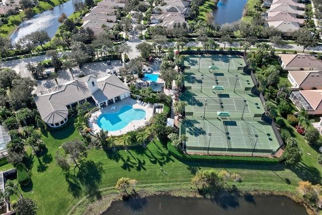 drone / aerial view with a water view and a residential view