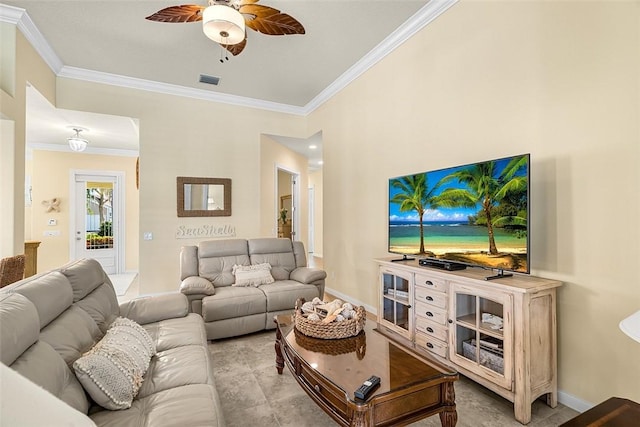 living area with ornamental molding, visible vents, and baseboards