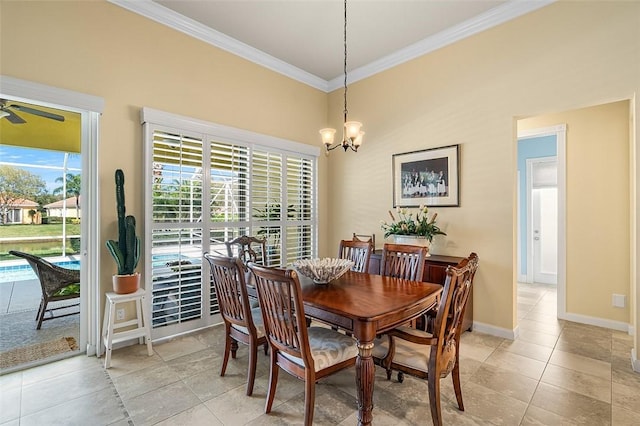 dining room featuring baseboards, crown molding, and ceiling fan with notable chandelier