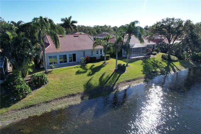 birds eye view of property with a water view