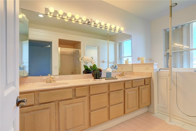 bathroom with tile patterned flooring, vanity, and a shower with shower door