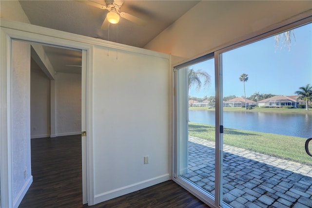 unfurnished sunroom with a water view, ceiling fan, and lofted ceiling