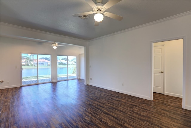 spare room with a textured ceiling, ceiling fan, ornamental molding, and dark wood-type flooring