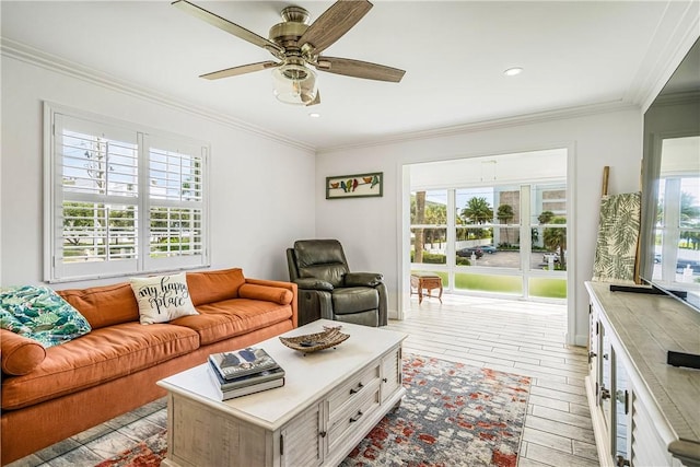 1441 Ocean Dr Unit 207, Vero Beach, FL 32963 - living room featuring plenty of natural light, crown molding, ceiling fan, light wood finished floors, and recessed lighting