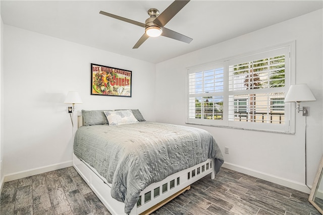 bedroom featuring ceiling fan and dark hardwood / wood-style floors