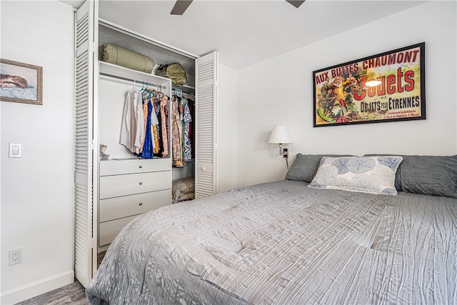 bedroom featuring hardwood / wood-style flooring, a closet, and ceiling fan