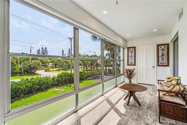 1441 Ocean Dr Unit 207, Vero Beach, FL 32963 - sunroom / solarium with plenty of natural light, hardwood / wood-style flooring, and recessed lighting