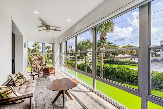 sunroom with a wealth of natural light and ceiling fan