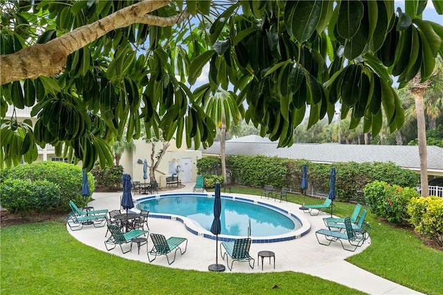 community pool with a patio area