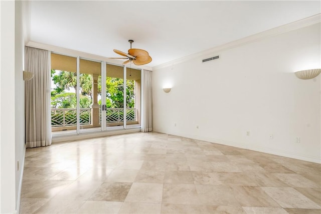 unfurnished room with visible vents, crown molding, baseboards, floor to ceiling windows, and a ceiling fan