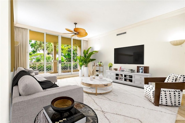 living room featuring visible vents, a wall of windows, crown molding, and ceiling fan