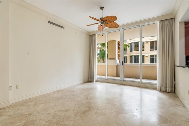 unfurnished room featuring ceiling fan, visible vents, baseboards, and ornamental molding