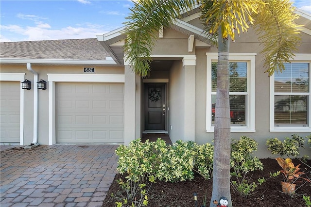 doorway to property featuring a garage