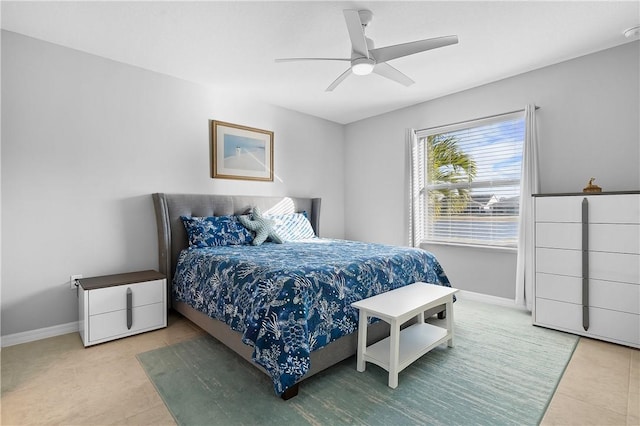 bedroom with tile patterned floors and ceiling fan