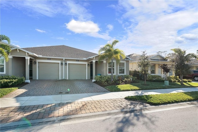 ranch-style house with a front yard and a garage