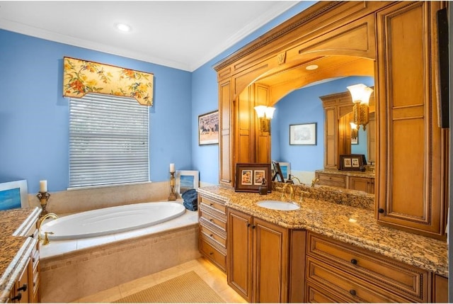 bathroom with vanity, a relaxing tiled tub, and ornamental molding