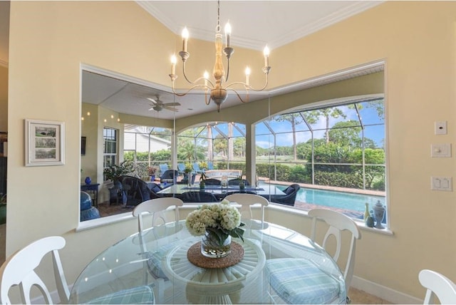 dining room featuring ceiling fan with notable chandelier and ornamental molding