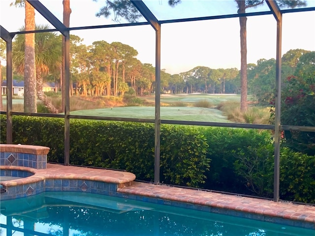 view of pool with a mountain view and glass enclosure