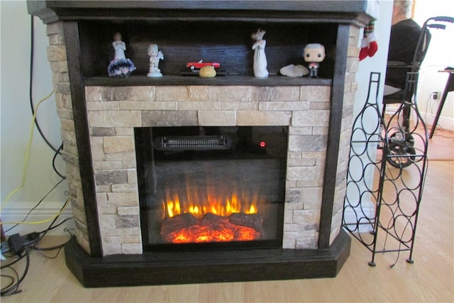 details featuring wood-type flooring and a fireplace