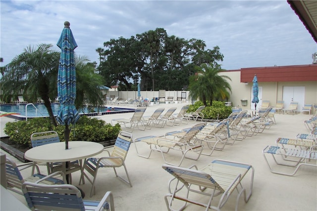 view of patio featuring a community pool