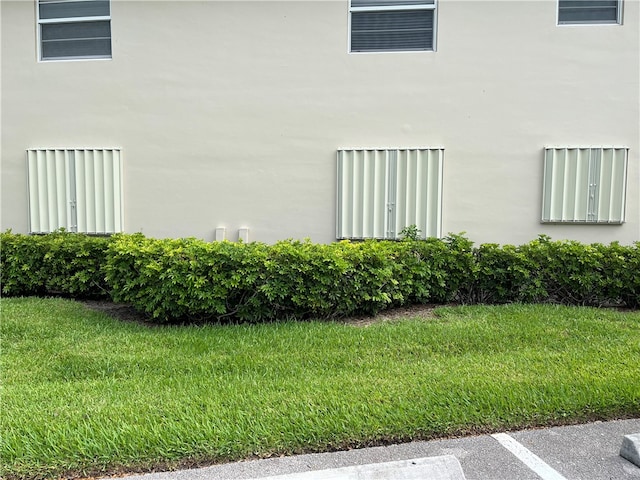 view of property exterior featuring a yard