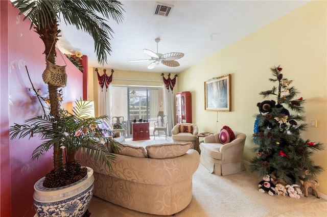 carpeted living room with ceiling fan