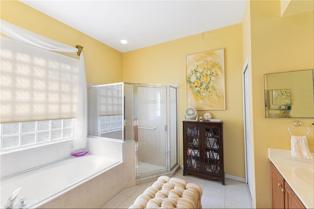 bathroom with vanity, tile patterned floors, and separate shower and tub