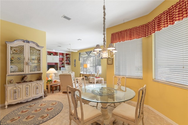 430 25th Ave SW, Vero Beach, FL 32962 - dining space featuring light tile patterned flooring, a chandelier, and ceiling fan