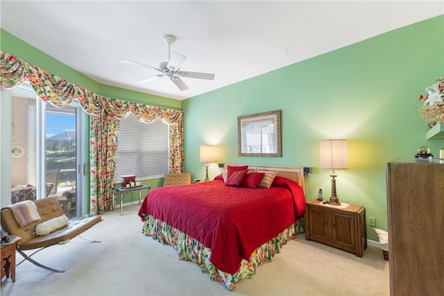 bedroom featuring light colored carpet, access to exterior, and ceiling fan