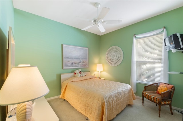 bedroom featuring ceiling fan and light colored carpet