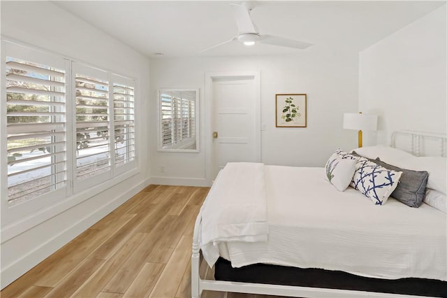 bedroom featuring ceiling fan and light hardwood / wood-style flooring