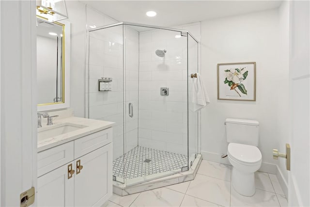 bathroom with toilet, a shower with shower door, and vanity