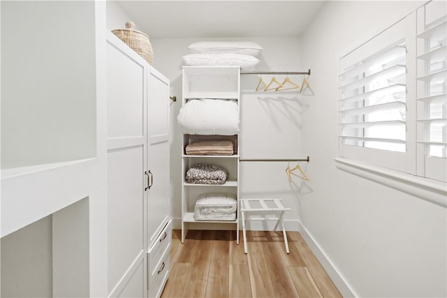 spacious closet featuring light hardwood / wood-style floors