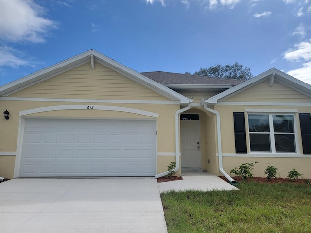 single story home featuring a garage