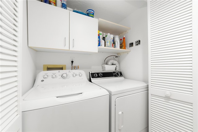 laundry area featuring cabinets and independent washer and dryer