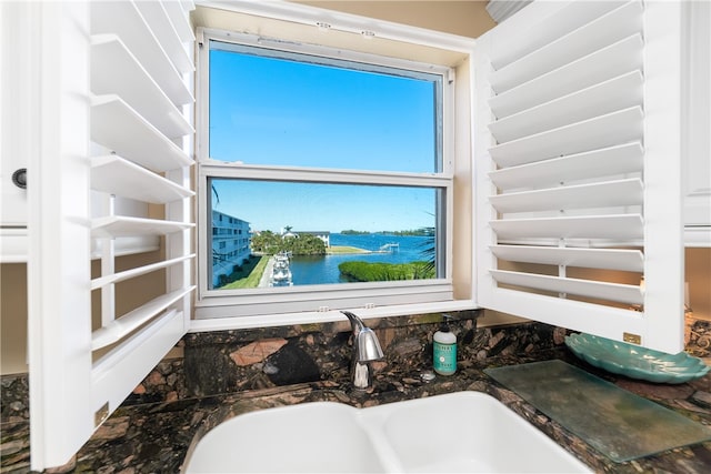 bathroom with vanity and a water view