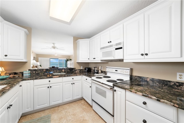 kitchen featuring white cabinets, white appliances, ceiling fan, and dark stone counters