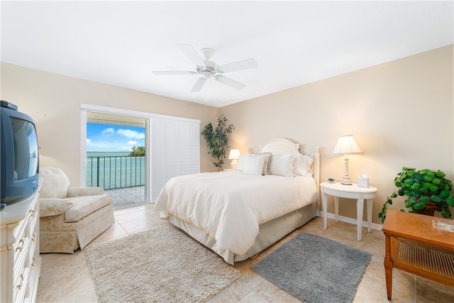 tiled bedroom with access to outside and ceiling fan