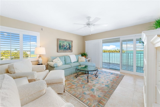 tiled living room featuring a wealth of natural light and ceiling fan