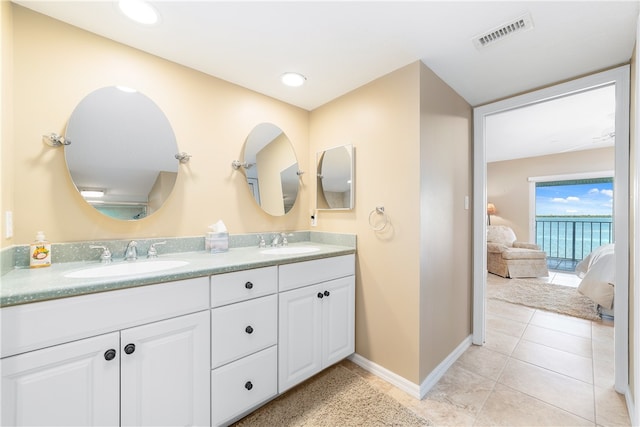 bathroom featuring tile patterned flooring and vanity