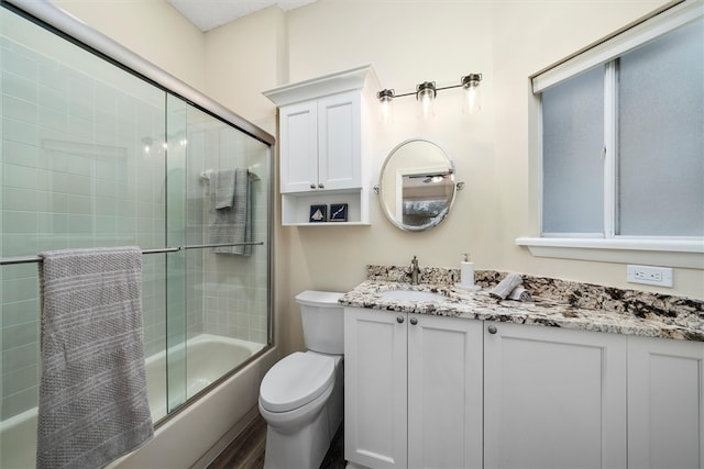 1335 Winding Oaks Cir E Unit 1007, Vero Beach, FL 32963 - full bathroom featuring vanity and bath / shower combo with glass door