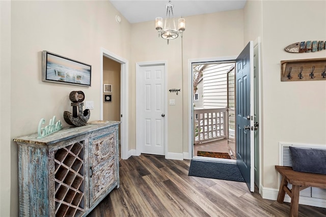 1335 Winding Oaks Cir E Unit 1007, Vero Beach, FL 32963 - entrance foyer with dark wood-type flooring and a chandelier