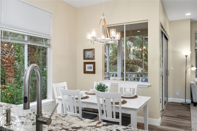 1335 Winding Oaks Cir E Unit 1007, Vero Beach, FL 32963 - dining area featuring a chandelier, wood finished floors, healthy amount of natural light, and recessed lighting