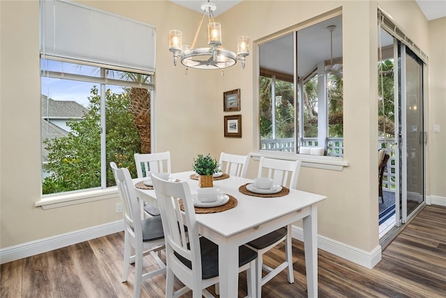 1335 Winding Oaks Cir E Unit 1007, Vero Beach, FL 32963 - dining room with a chandelier, healthy amount of natural light, and wood finished floors
