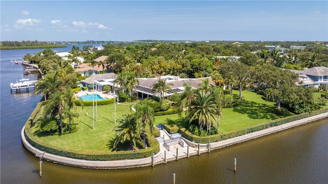 birds eye view of property with a water view