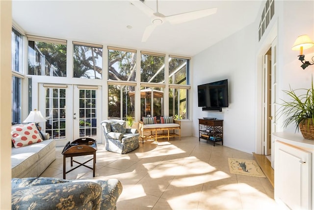 sunroom featuring ceiling fan and french doors